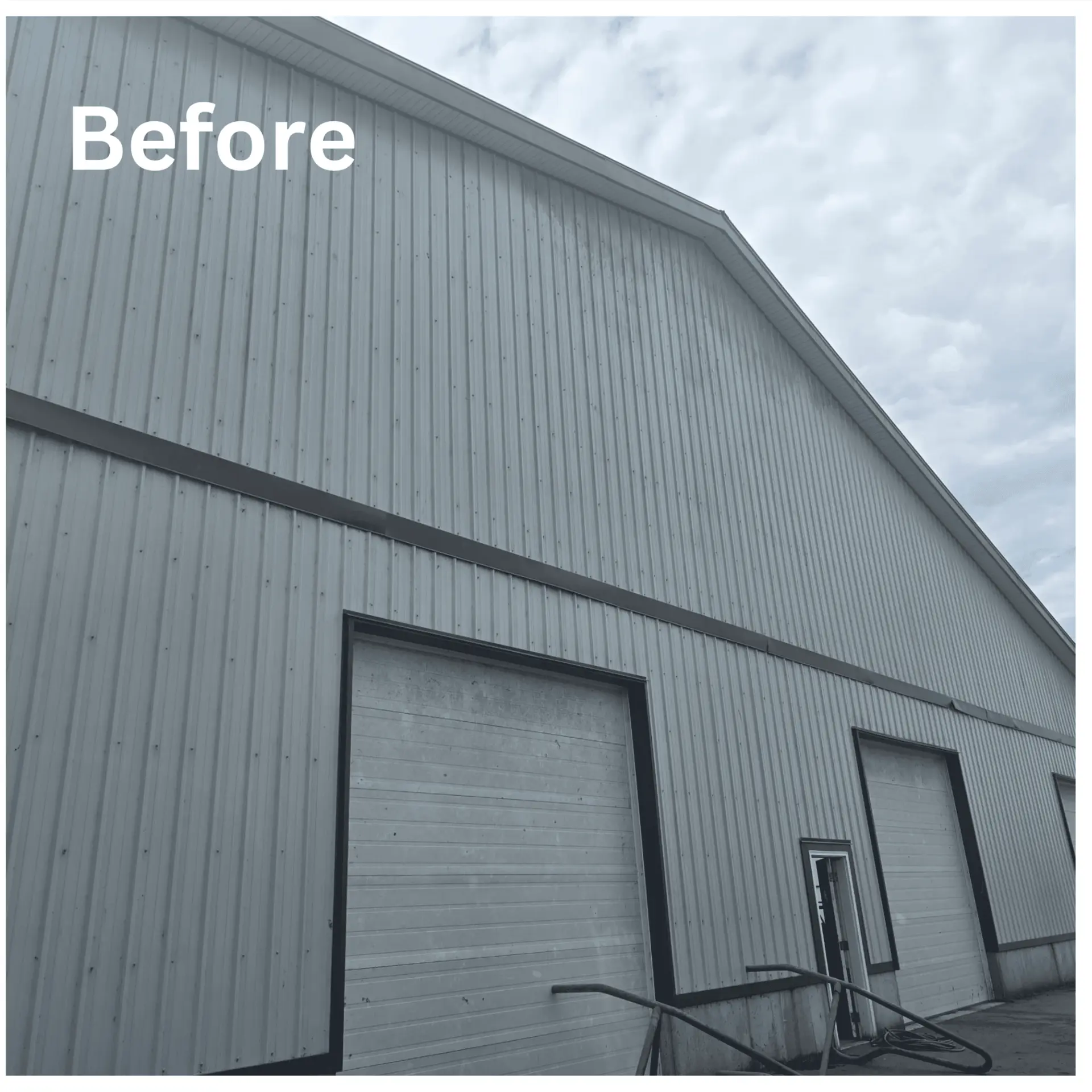 Grimy metal warehouse siding before exterior cleaning