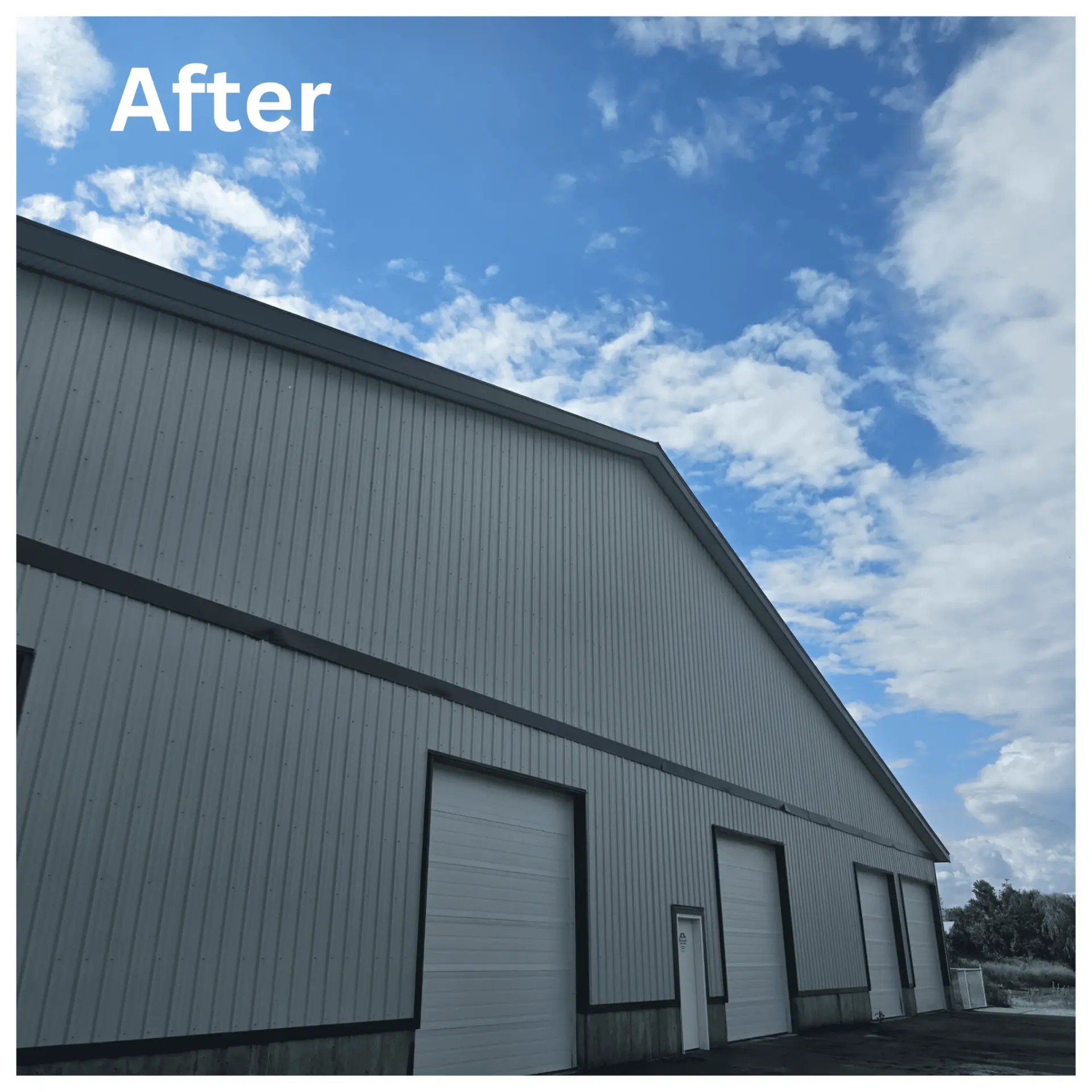 Freshly cleaned metal warehouse siding after exterior cleaning